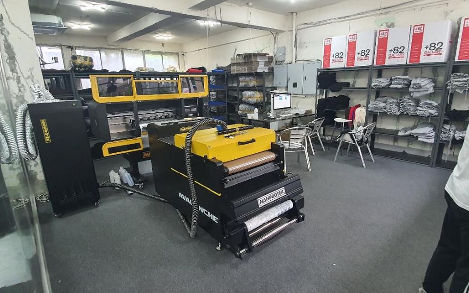 +82DESIGN print room with DTF transfer printers and powder shakers