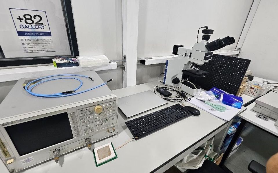 +82 R&D lab bench with RFID antenna measurement equipment and a microscope